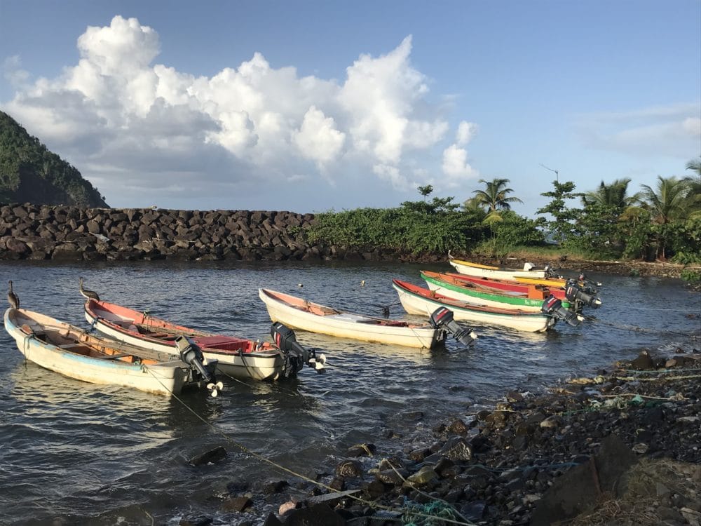 a row of empty boats in the water