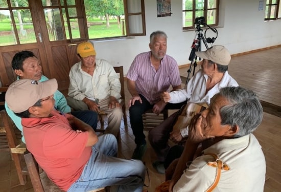group of men talking whilst being filmed